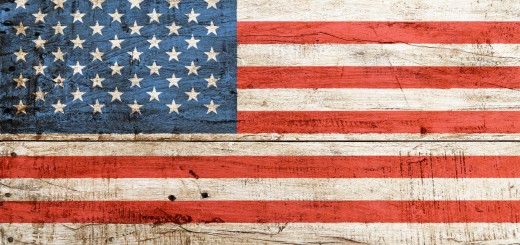 Old grunge vintage American US national flag over background of white painted wooden planks board